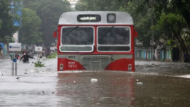 A bus tried to make it down a road in flooded Mumbai, 29 August 2017