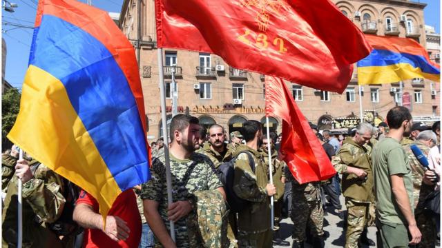 People attend a meeting to recruit military volunteers after Armenian authorities declared martial law and mobilised its male population following clashes with Azerbaijan over the breakaway Nagorno-Karabakh region in Yerevan, Armenia September 27, 2020.