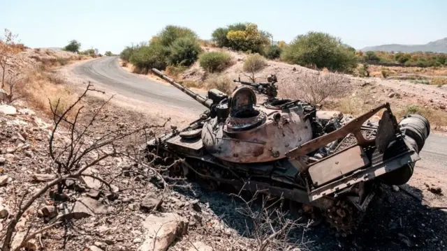 A damaged tank stands abandoned on a road near Humera, Ethiopia, on November 22, 2020.