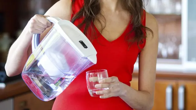 Pouring a glass of water