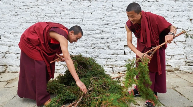 Bhutanese monks with juniper branches