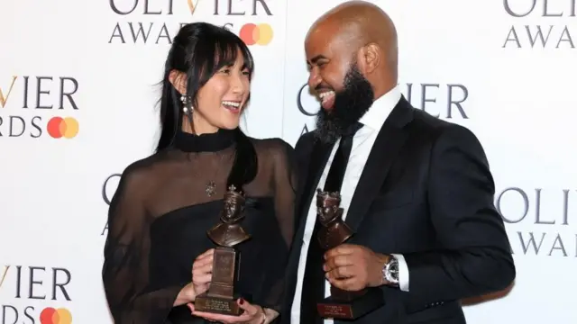 Jessica Hung Han Yun and Tony Gayle pose with the awards for Best Lighting and Best Sound Design for "RSC'S My Neighbor Totoro" at the Olivier Awards at the Royal Albert Hall in London, Britain, April 2, 2023. REUTERS/May James