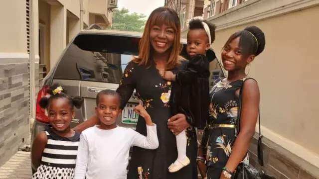 Catherine Okoro with her pikin dem