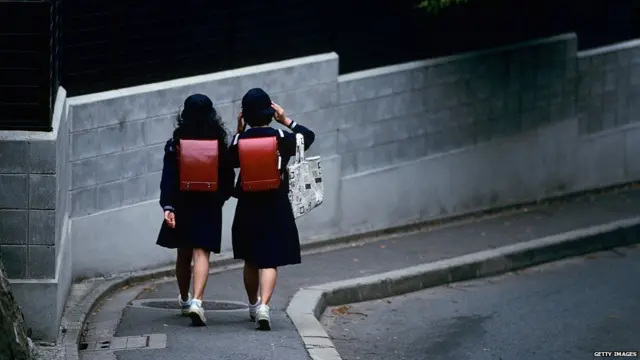 Two girls in school uniform