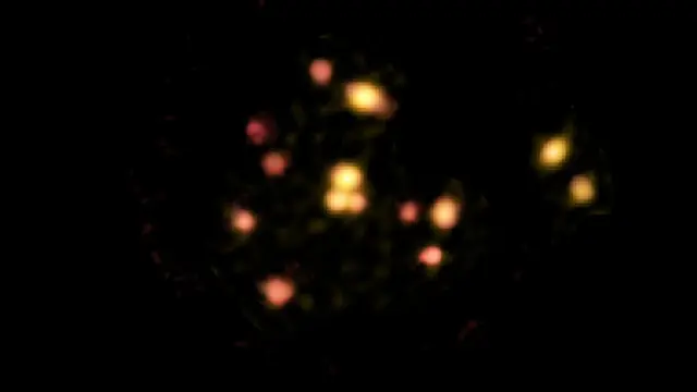 14 distinct but pixellated golden glowing circles