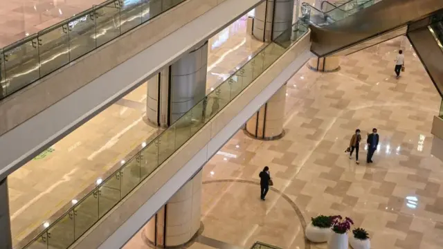 A quiet shopping mall in Wuhan in April, after many lockdown restrictions have been lifted