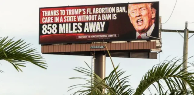 Cartaz com rostoslot zeroDonald Trump e dizeres sobre a políticaslot zeroproibiçãoslot zeroaborto na Flórida