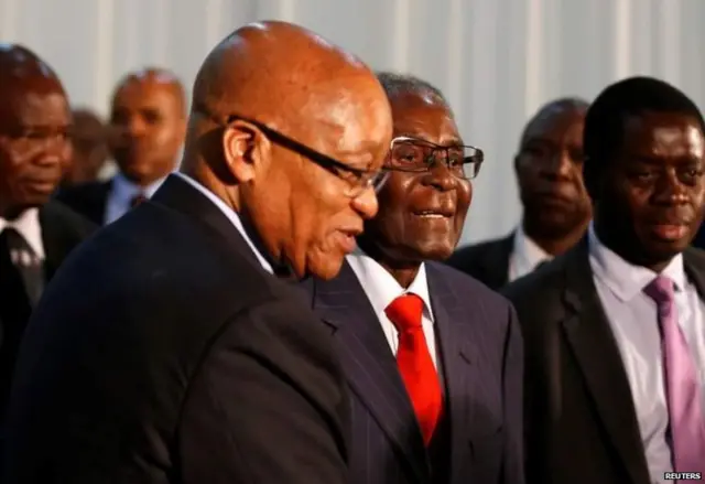 Robert Mugabe (C) met his South African counterpart Jacob Zuma (L) last month in Pretoria