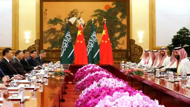 Saudi Crown Prince Mohammed bin Salman (R) attends a meeting with Chinese President Xi Jinping (L) at the Great Hall of the People in Beijing on February 22, 2019