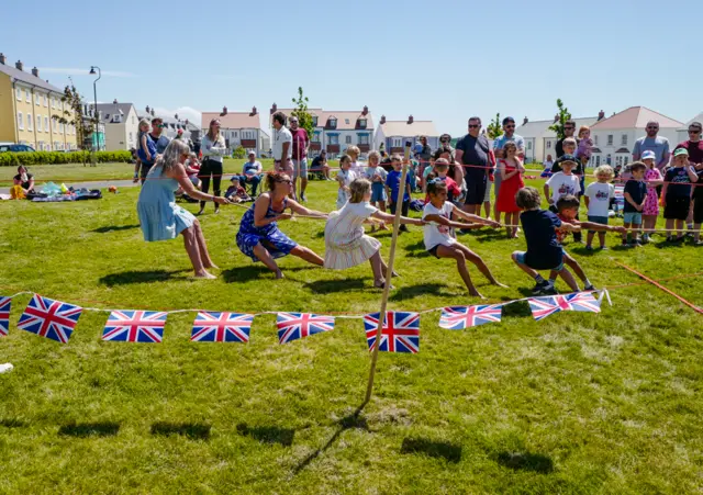 Young children take part in a tug-of-war at Nansledan on 3 June 2022 in Newquay, Cornwall