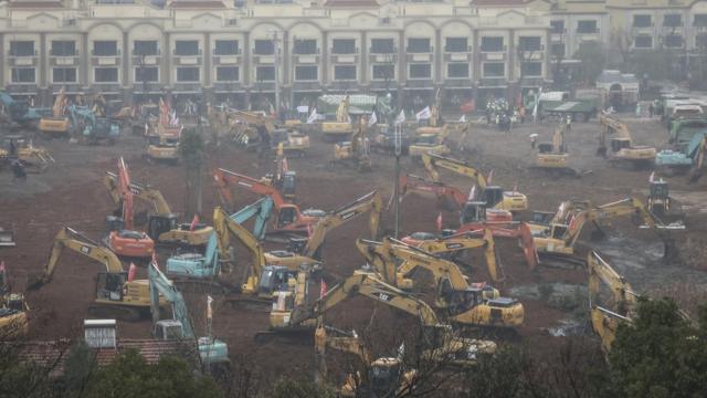 Diggers on the site of the new hospital in Wuhan