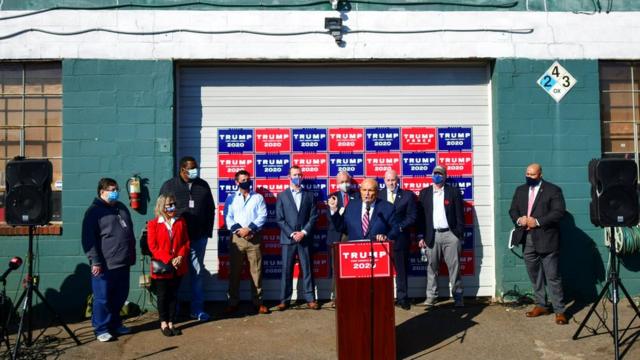 Rudy Giuliani gives a news conference outside a landscaping centre