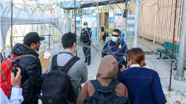 U.S. Customs agents check vaccination cards at the San Ysidro Port of Entry on November 8, 2021 in Tijuana, Mexico.