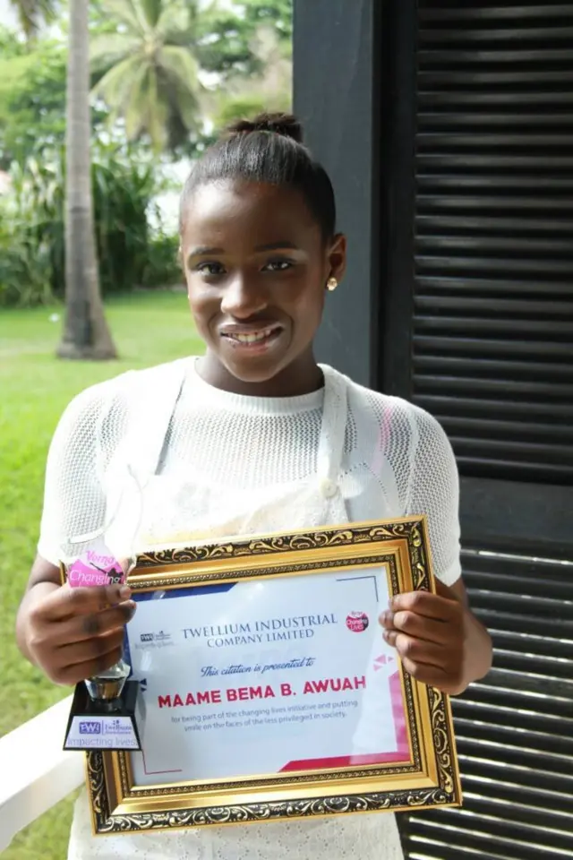 Maame with her ambassador certificate.