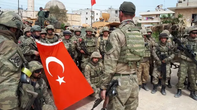 Turkish soldiers stand in crescent form in town center after Turkish Armed Forces and Free Syrian Army (FSA) took complete control of northwestern Syria's Afrin within the 'Operation Olive Branch' on March 18, 2018. 'Afrin town center was completely taken control of at 8.30 a.m
