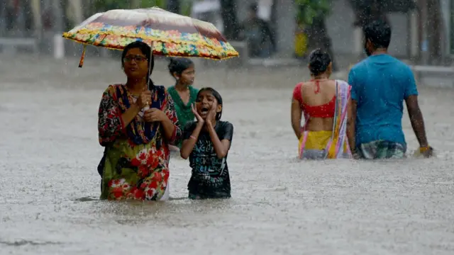 వరద నీటిలో జనం / People in flood water