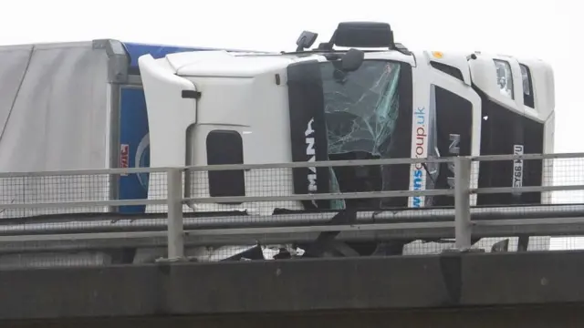 A lorry seen on its side on the M4 during storm Eunice on 18 February 2022 in Margam, Wales