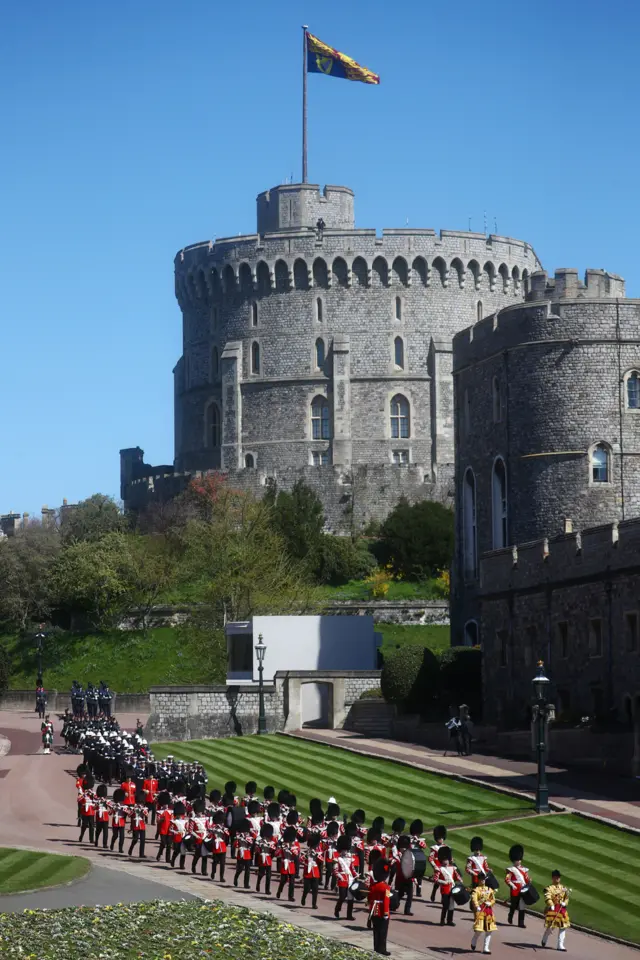 he Foot Guards Band are seen marching into position ahead of the funeral of Prince Philip, Duke of Edinburgh at Windsor Castle on April 17, 2021 in Windsor, England