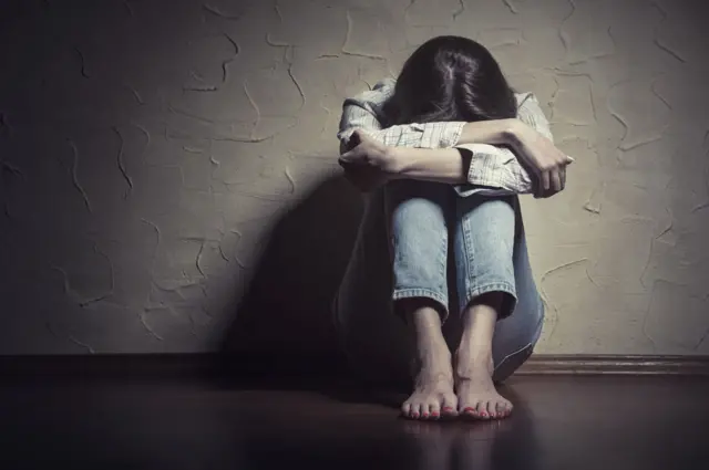 Mujer víctima de abuso.