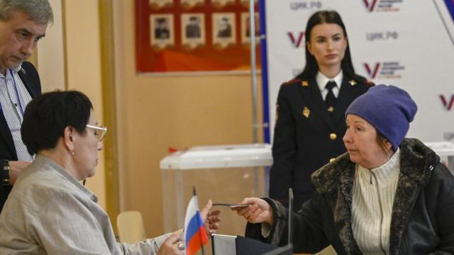 Citizens cast their votes at a polling station during the Russian presidential election in Moscow, Russia on March 17, 2024