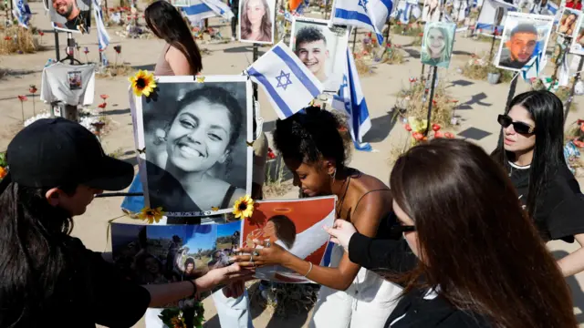 People visit the site of the Nova festival, on 7 November 2024, six months after the deadly 7 October 7 attack