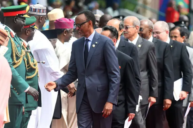 Rwandan President Paul Kagame (C) arrives to attend Nigeria's national Democracy Day celebrations in Abuja, on June 12, 2019. - Nigeria celebrates the Day of Democracy on June 12, commemorating the country's first free elections, on June 12, 1993, after a decade of military rule. (Photo by PIUS UTOMI EKPEI / AFP) (Photo credit should read PIUS UTOMI EKPEI/AFP/Getty Images)