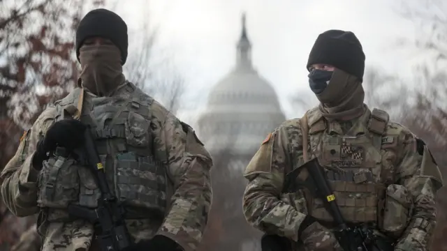 US National Guardsmen stand on a closed street outside the Capitol Building
