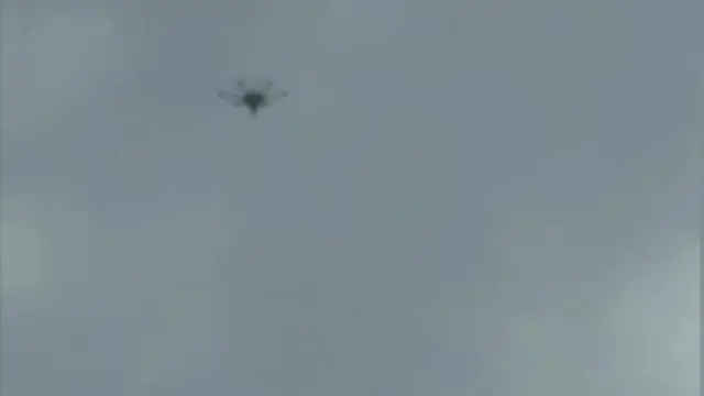 Кадр из видео с изображением дрона в полете