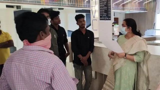 సినిమా థియేటర్ వద్ద ప్రభుత్వ అధికారి