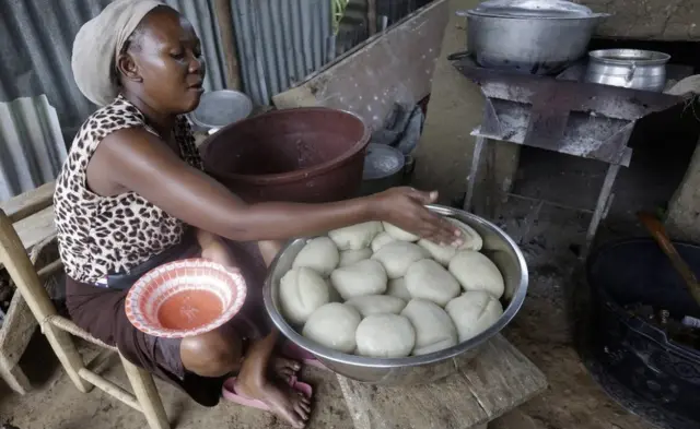 A woman prepares fufu, made from pounded cassava, in Monrovia, Liberia - Saturday 19 June 2021
