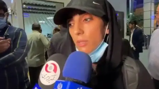 Elnaz Rekabi is interviewed by Iranian state media at Tehran's international airport on 19 October 2022