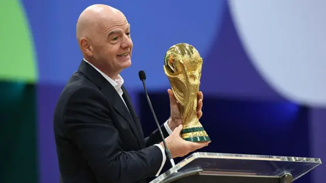 FIFA President Gianni Infantino holds the FIFA World Cup winner's trophy while speaking during the FIFA World Cup 2026 International Broadcast Center Grand Opening ceremony on June 01, 2026 in Dallas, Texas.