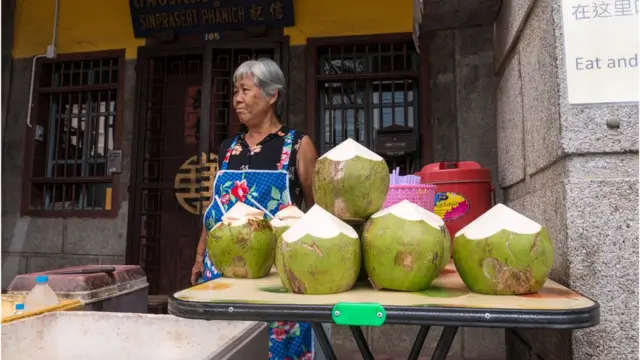 A coconut seller in old Phuket Town
