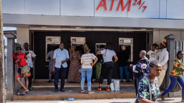 People using ATMs