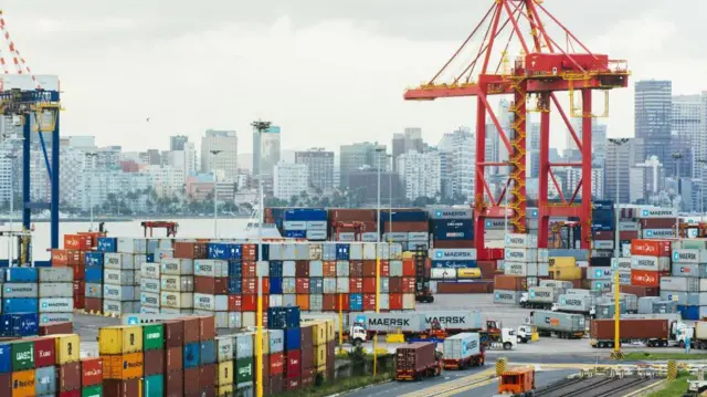 A ship-to-shore crane stands above shipping containers on the dockside at the Port of Durban in 2018.