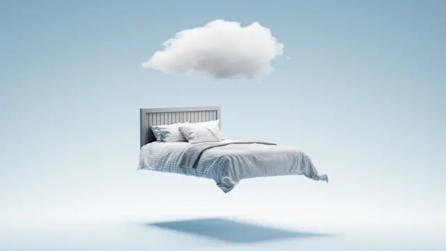 Un lit avec un nuage.