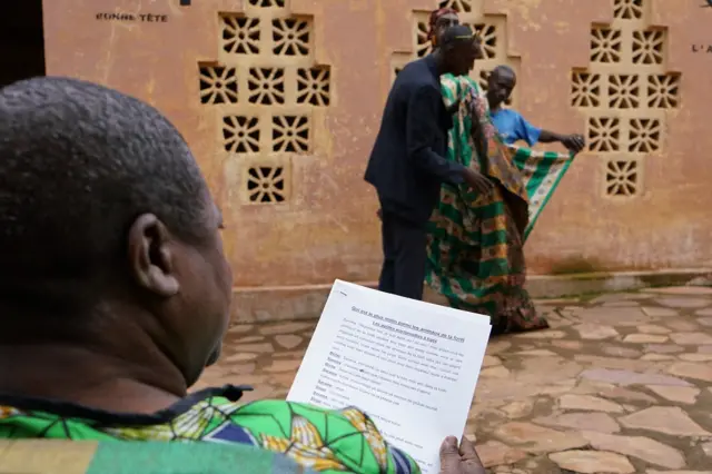 Man reading a script