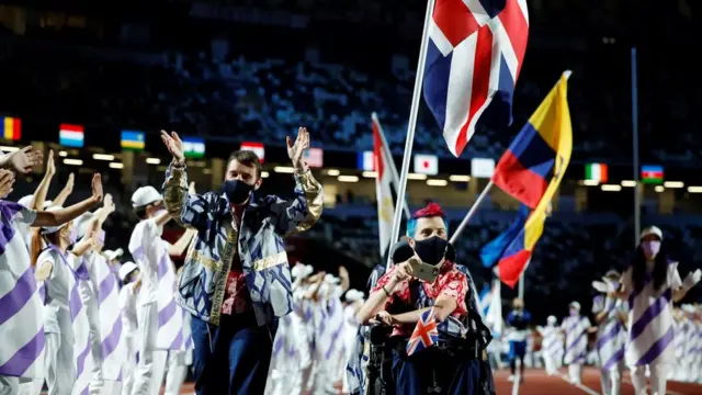 Tokyo 2020 Paralympic Games - The Tokyo 2020 Paralympic Games Closing Ceremony - Olympic Stadium, Tokyo, Japan - September 5, 2021. David Smith of Britain carries the Union Jack during the closing ceremony REUTERS/Issei Kato