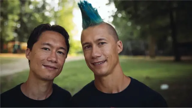 Identical twin brothers attend the Twins Days Festival in Twinsburg, Ohio