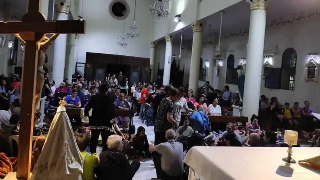 People inside the Holy Family Church in Gaza