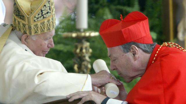 Newly appointed cardinal George Pell of Australia kisses Pope John Paul II's hand on St Peter square 21 October 2003 at the Vatican during the ordination ceremony of new cardinals.