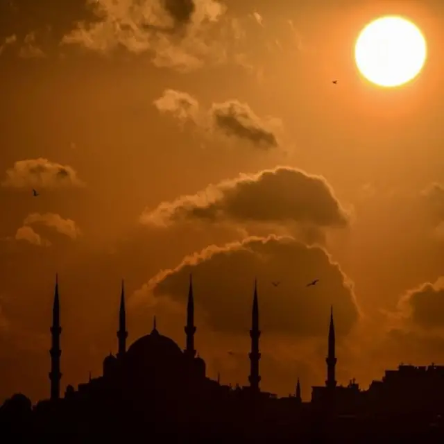 The sun sets over Sultanahmet mosque (also known as the Blue mosque) in Istanbul, Turkey