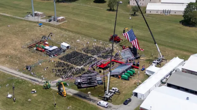 A drone view shows the stage where Republican presidential candidate and former U.S. President Donald Trump had been standing during an assassination attempt the day before, and the roof of a nearby building where a gunman was shot dead by law enforcement, in Butler,