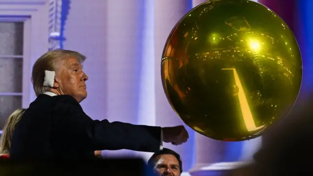 Republican presidential nominee and former U.S. President Donald Trump plays with a balloon after he finished giving his acceptance speech on Day 4 of the Republican National Convention (RNC), at the Fiserv Forum in Milwaukee,