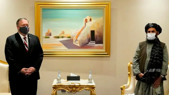 সাবেক মার্কিন পররাষ্ট্রমন্ত্রী মাইক পম্পেও এবং মোল্লাহ বারাদার