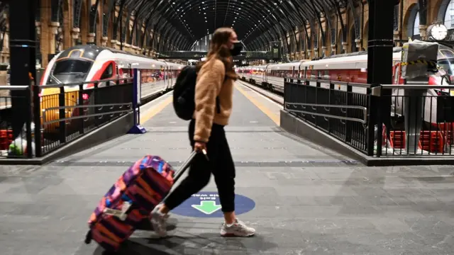 A commuter at Kings Cross train station in London