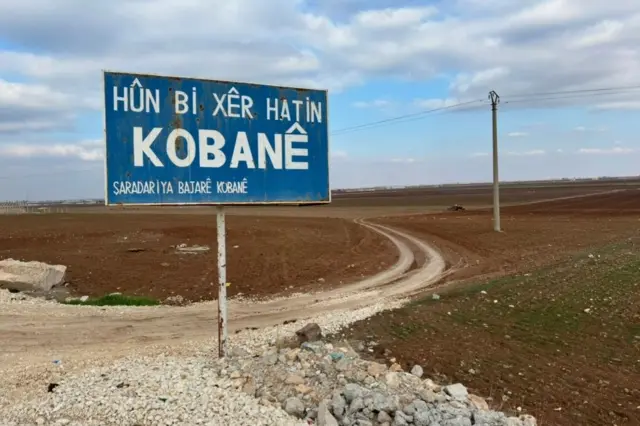 تابلوی به کوبانی خوش آمدید