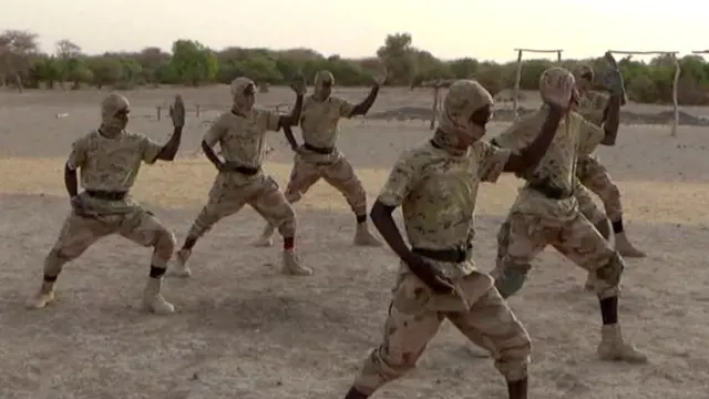 JNIM fighters, in camouflage, train at an undisclosed location