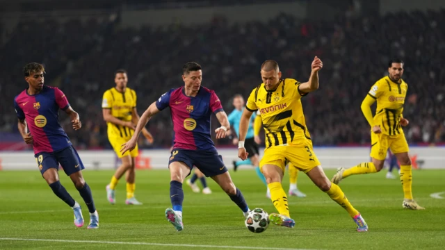 Players on the pitch with ball