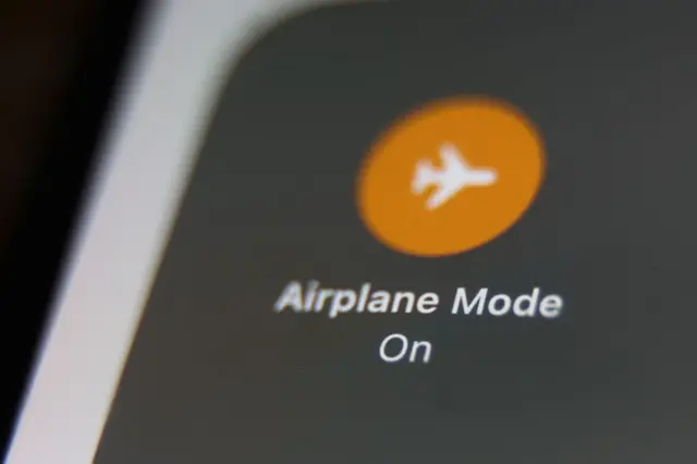 Illustration of phone dey wit di airplane mode on showing